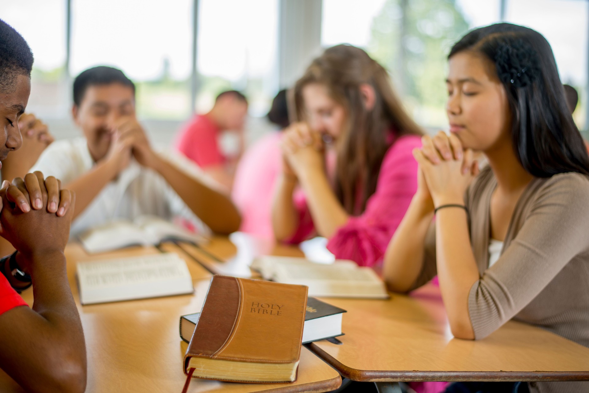 High School Students Praying Together